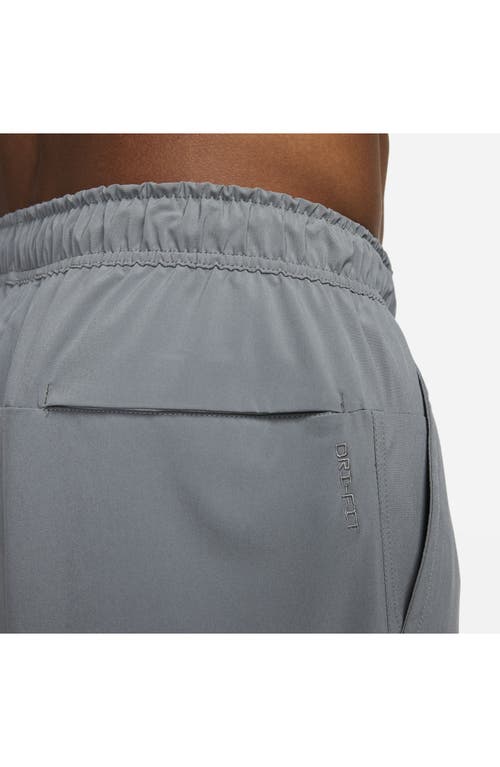 Shop Nike Dri-fit Unlimited 5-inch Athletic Shorts In Smoke Grey/black/smoke Grey