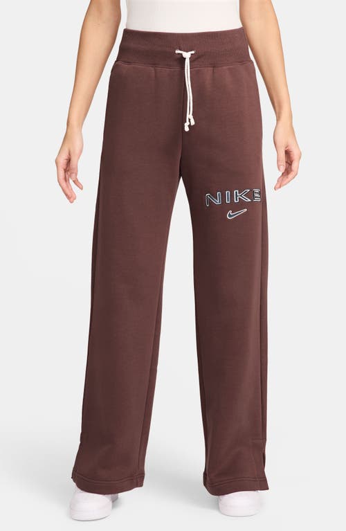 Shop Nike Phoenix High Waist Logo Fleece Sweatpants In Red Sepia