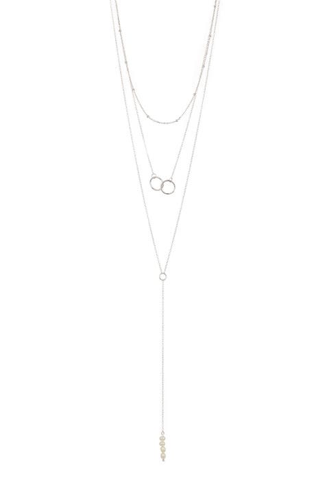 White Rhodium Plated Triple Strand Interlocking Ring & 19mm Freshwater Pearl Necklace