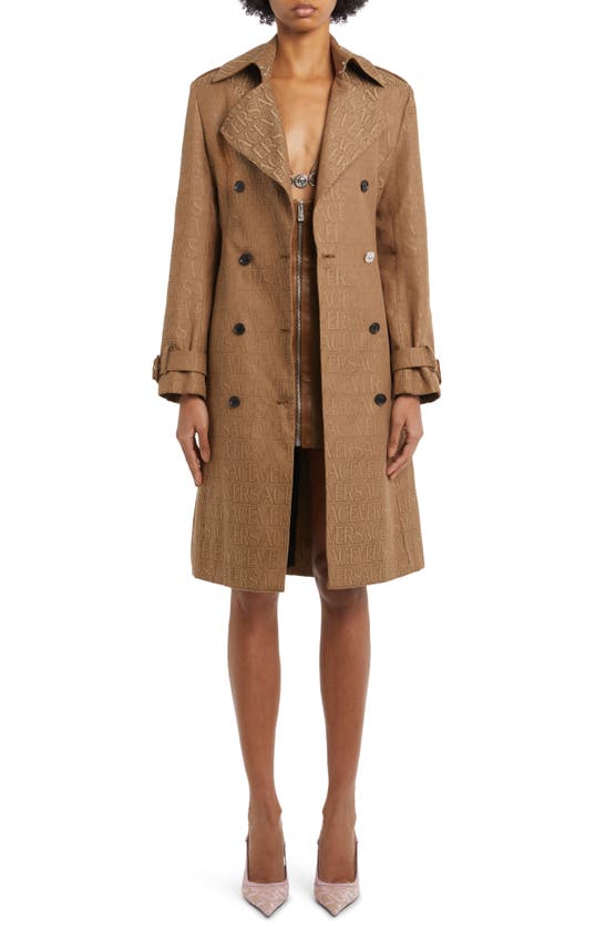 All over logo trench coat by Versace La Vacanza