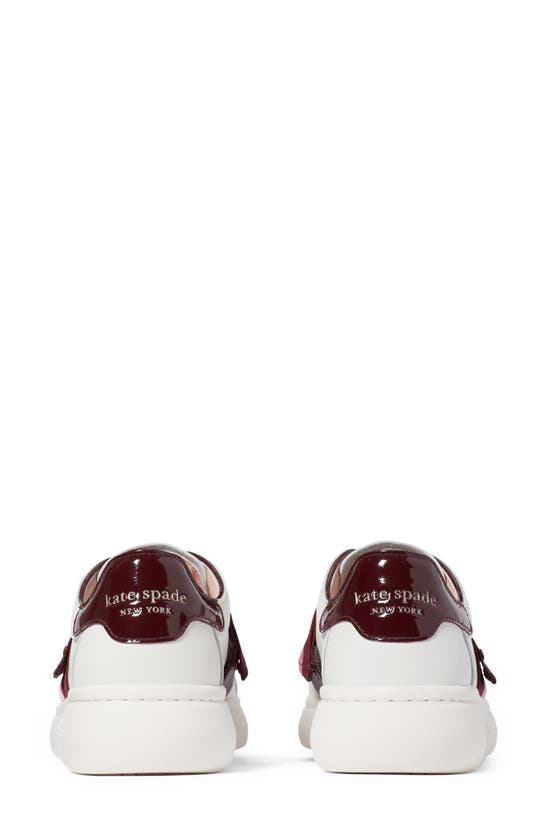 Shop Kate Spade Lexi Sneaker In Optic White/ Cordovan