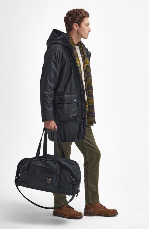 Shop Barbour Field Water Resistant Waxed Cotton Duffle Bag In Black