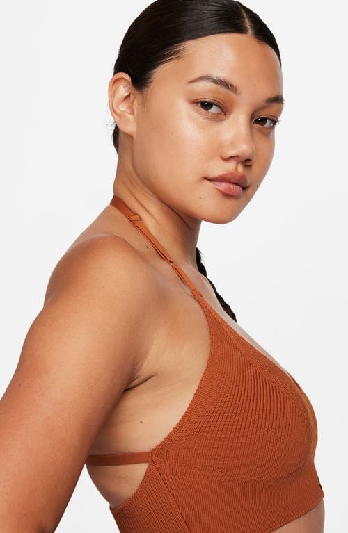 Shop Nike Dri-fit Sport Lifestyle Rib Sports Bra In Burnt Sunrise/white