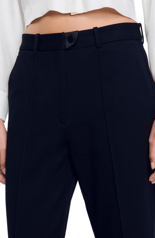 Shop Sandro Technical Material Trousers In Black