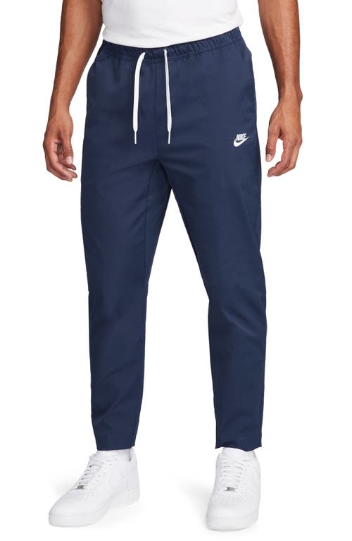 Shop Nike Woven Tapered Leg Pants In Midnight Navy/white