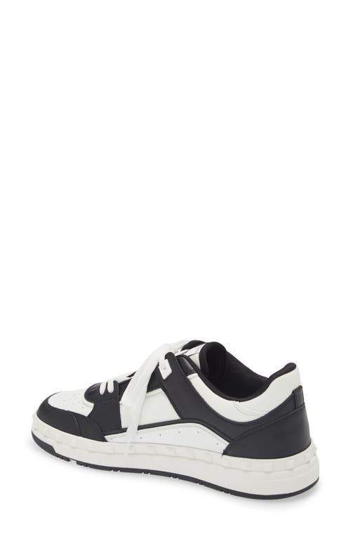 Shop Valentino Garavani Rockstud Low Top Sneaker In Bianco/nero