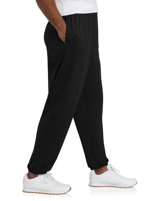 Shop Reebok Performance Jersey Elastic-hem Tech Pants In Black