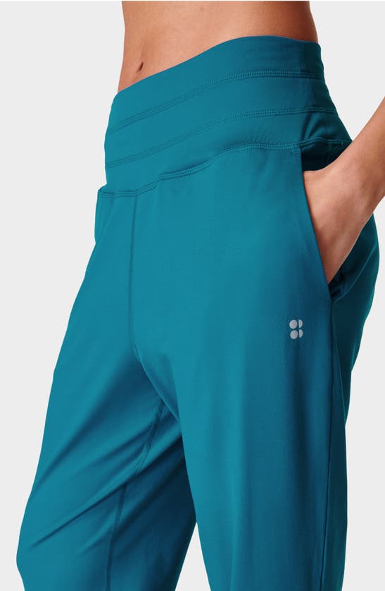 Shop Sweaty Betty Gaia Pocket Joggers In Reef Teal Blue