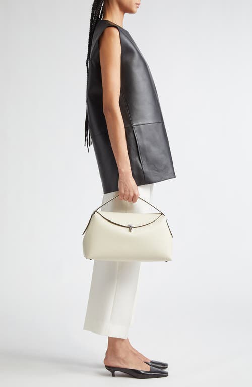 Shop Totême Toteme T-lock Curved Leather Shoulder Bag In Milk