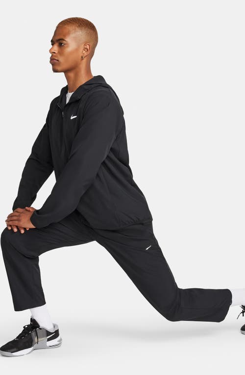 Shop Nike Form Dri-fit Versatile Pants In Black/silver