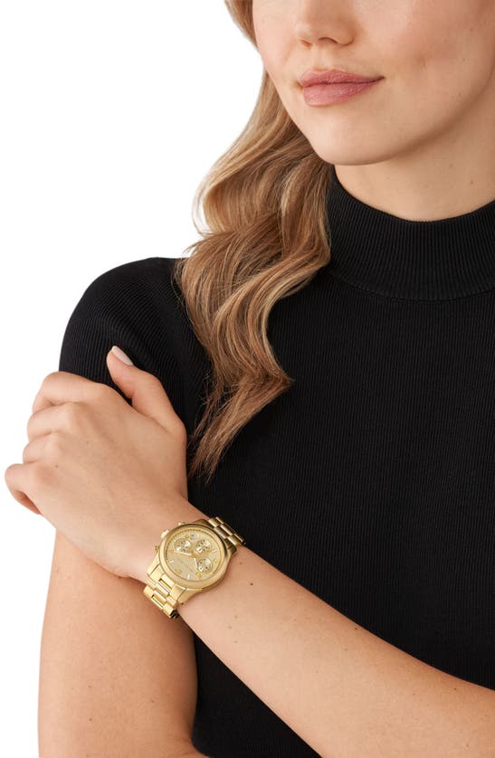 Michael Kors gold watch and Accessory Concierge bracelet, and