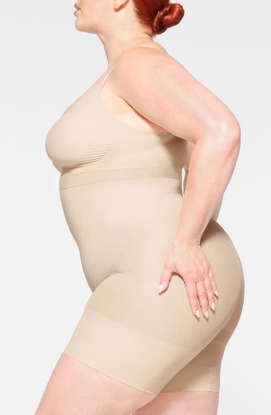 Skims Seamless Sculpt Low Back Mid Thigh Bodysuit In Sand