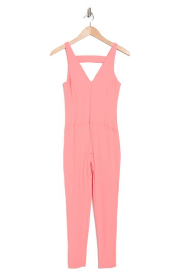 Fp Movement By Free People Never Better Strappy Back Jumpsuit In Neon Coral