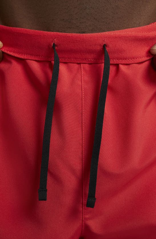 Shop Nike Dri-fit Challenger Athletic Shorts In University Red/ Black
