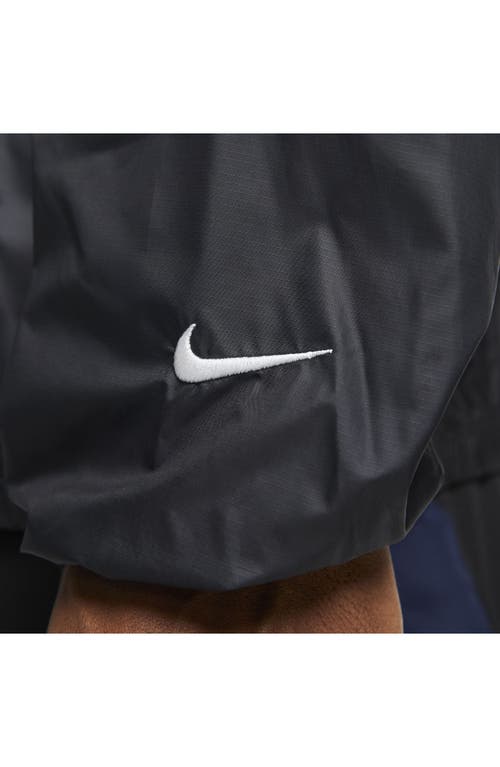 Shop Nike Storm-fit Track Club Woven Running Jacket In Black/midnight Navy/white