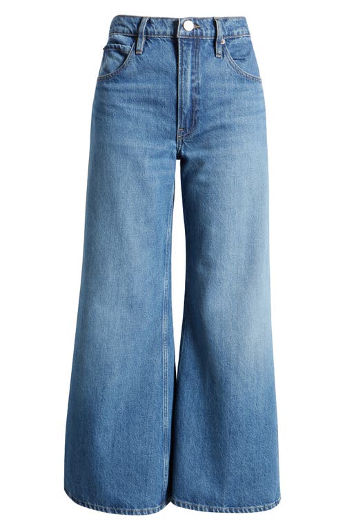 Shop Frame Pixie Easy Wide Leg Flare Jeans In Lucite