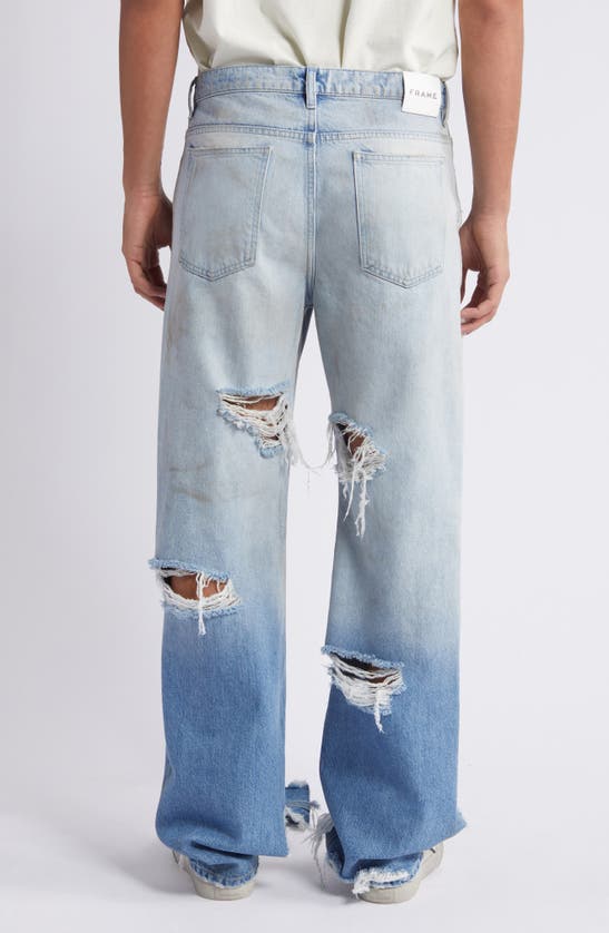 Shop Frame The Boxy Ripped Straight Leg Jeans In Lagoon Rips