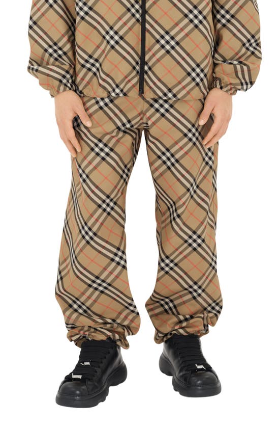 Shop Burberry Check Twill Drawstring Pants In Sand Check