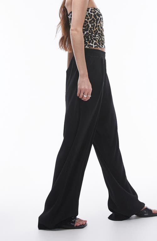 Shop Topshop Balloon Leg Plissé Pants In Black