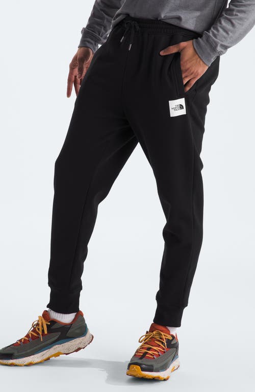 Shop The North Face Core Joggers In Tnf Black/tnf White