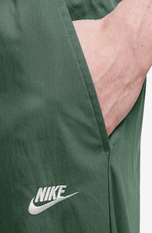 Shop Nike Woven Tapered Leg Pants In Fir/white