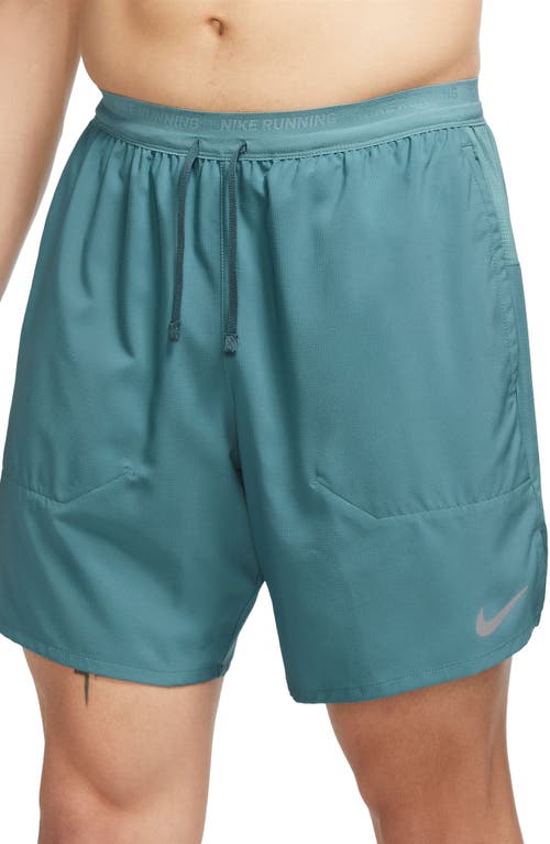 Shop Nike Dri-fit Stride 2-in-1 Running Shorts In Mineral Teal/reflective Silv