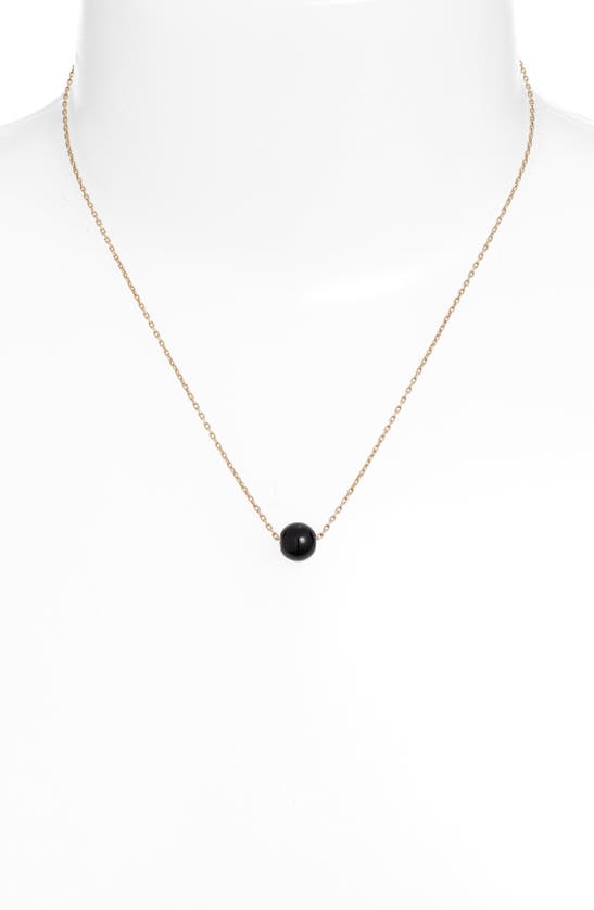 Shop Knotty Pendant Necklace In Gold/black