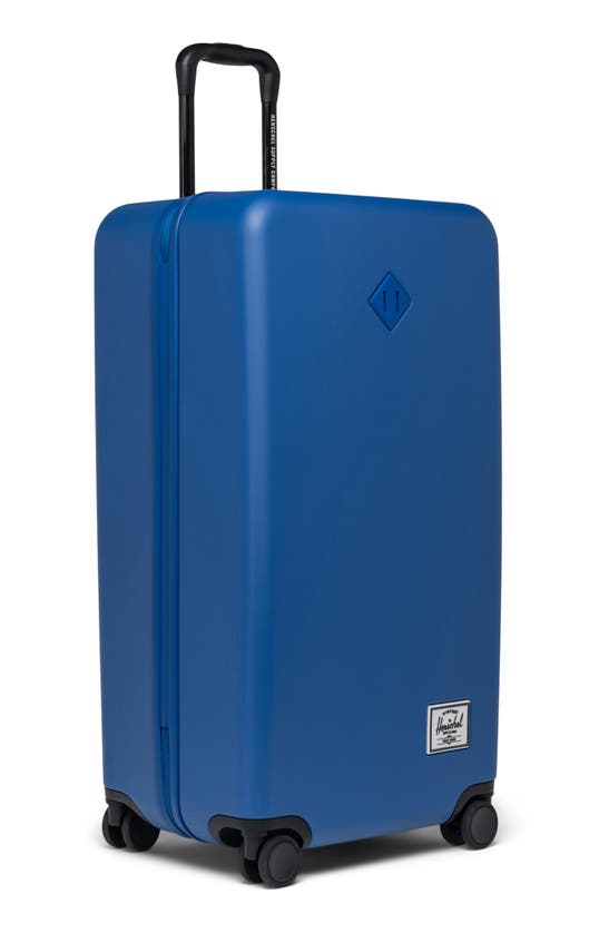 Shop Herschel Supply Co Heritage™ Hardshell Large Luggage In True Blue