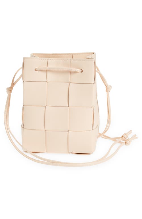 Shop Bottega Veneta Mini Cassette Drawstring Bucket Bag In Melon Washed Gold