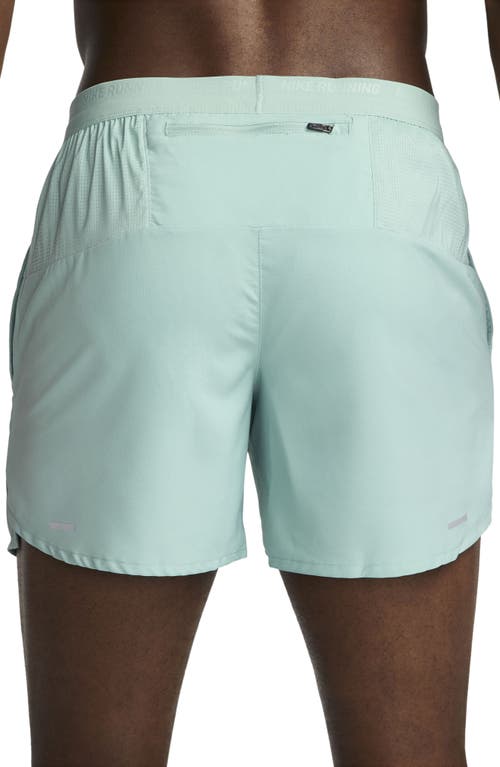 Shop Nike Dri-fit Stride 5-inch Running Shorts In Mineral/jade Ice