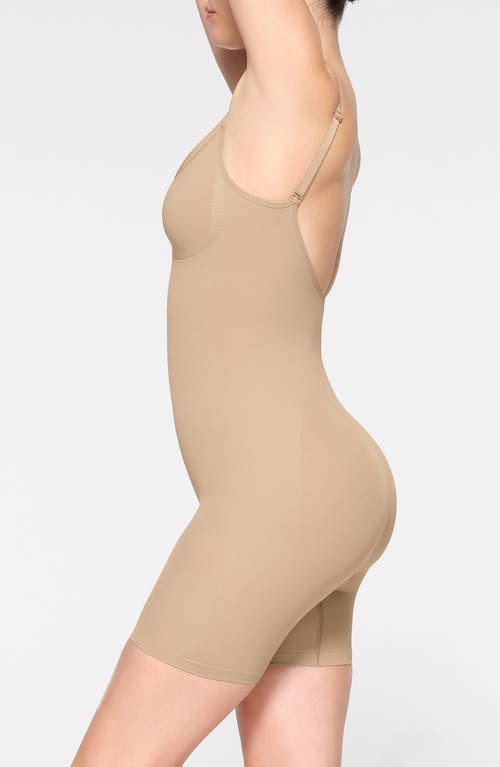 Shop Skims Seamless Sculpt Low Back Mid Thigh Bodysuit In Clay