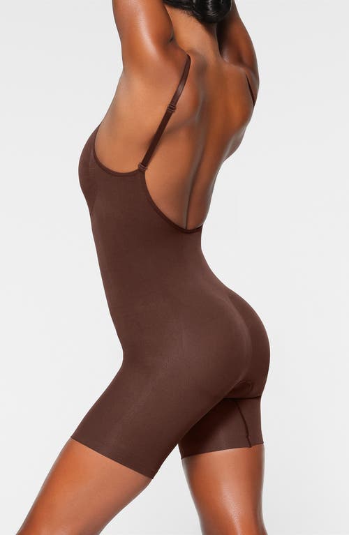 Shop Skims Seamless Sculpt Low Back Mid Thigh Bodysuit In Cocoa