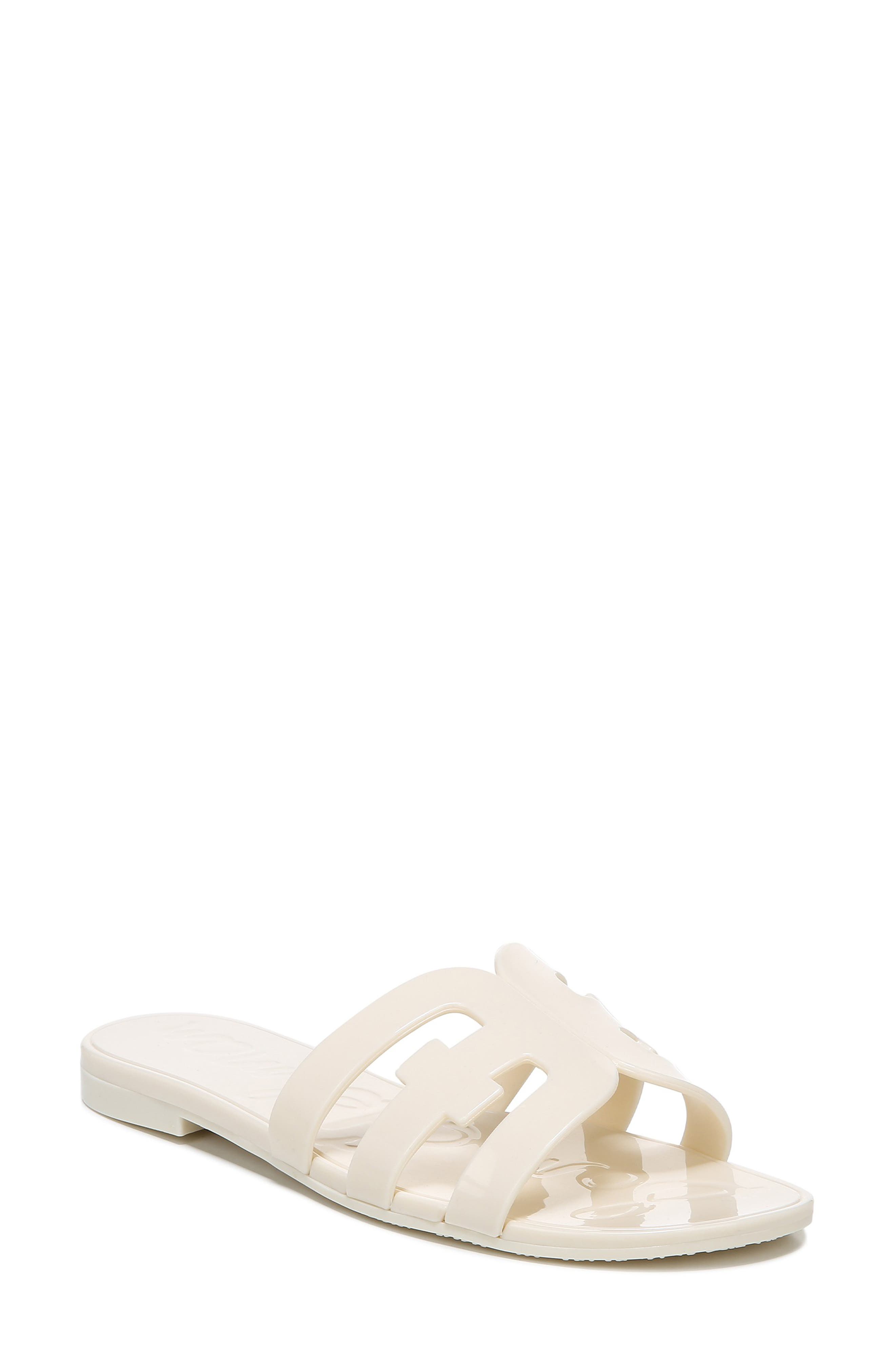 white flat slippers