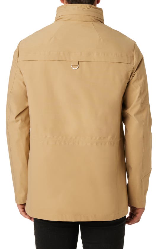 Shop Vince Camuto Water Resistant Stowaway Hood Coat In Tan