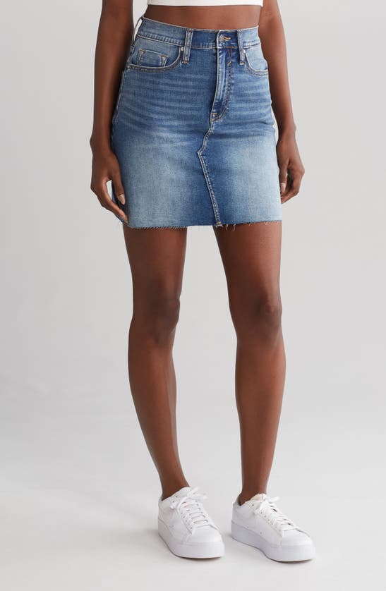 Shop Vigoss Raw Hem Denim Miniskirt In Medium Wash