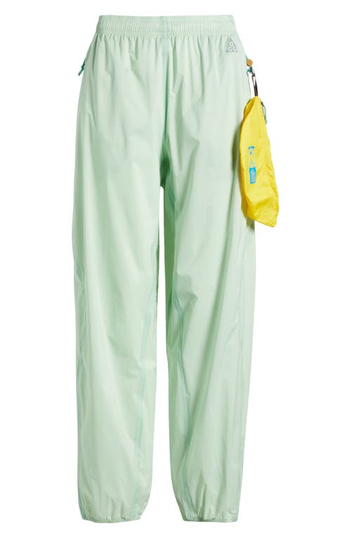 Shop Nike Acg Trail Snacks Storm-fit Adv Pants In Vapor Green/reflective Silver