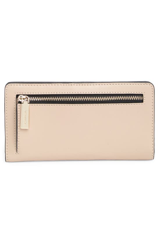 Shop Kate Spade Large Slim Bifold Wallet In Warm Beige Multi