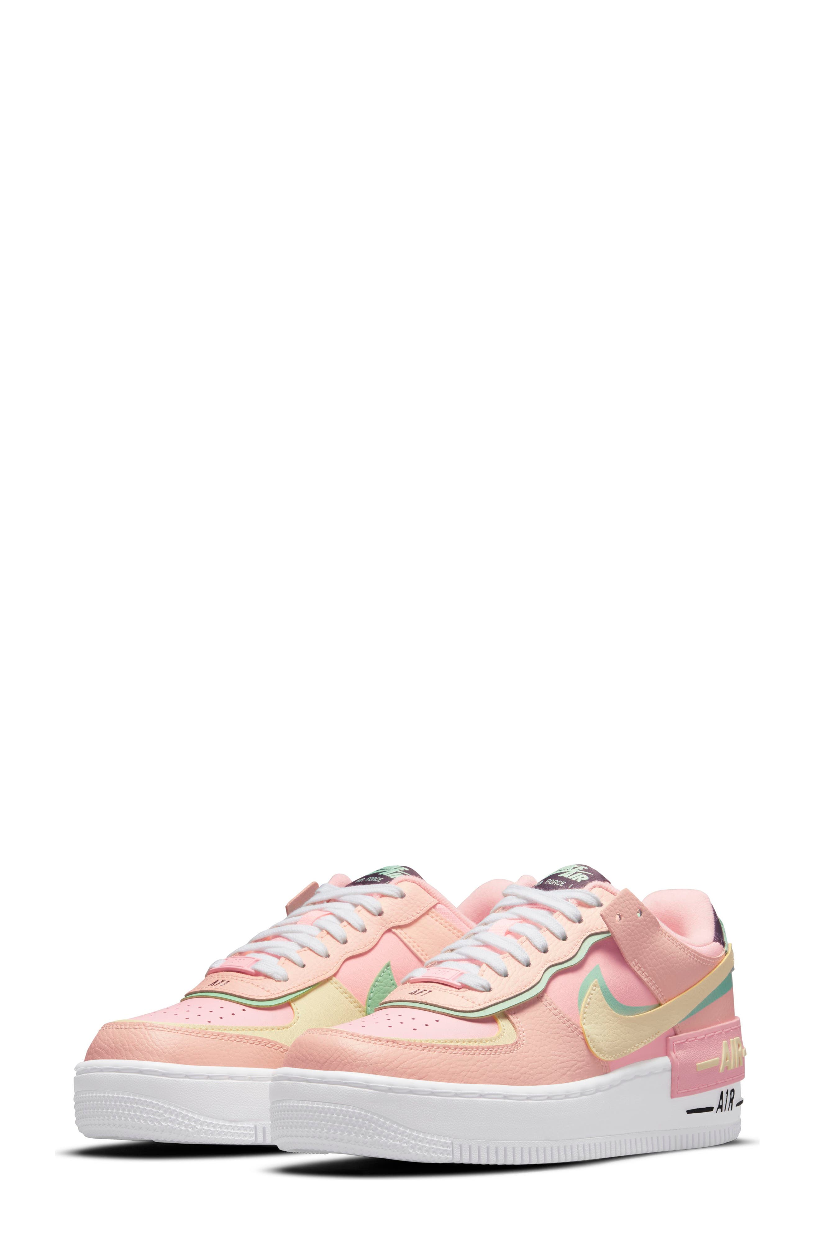 white and pink sneakers