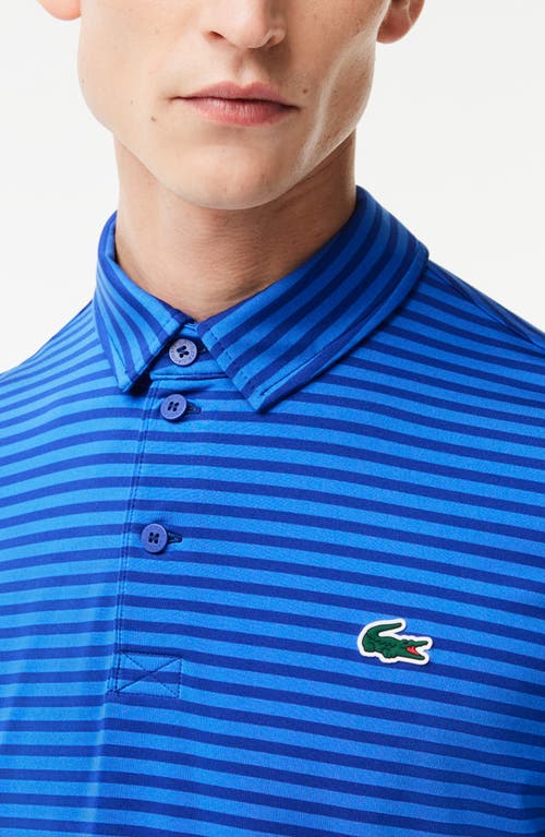 Shop Lacoste Ultradry Stripe Performance Golf Polo In Capitaine/ladigue