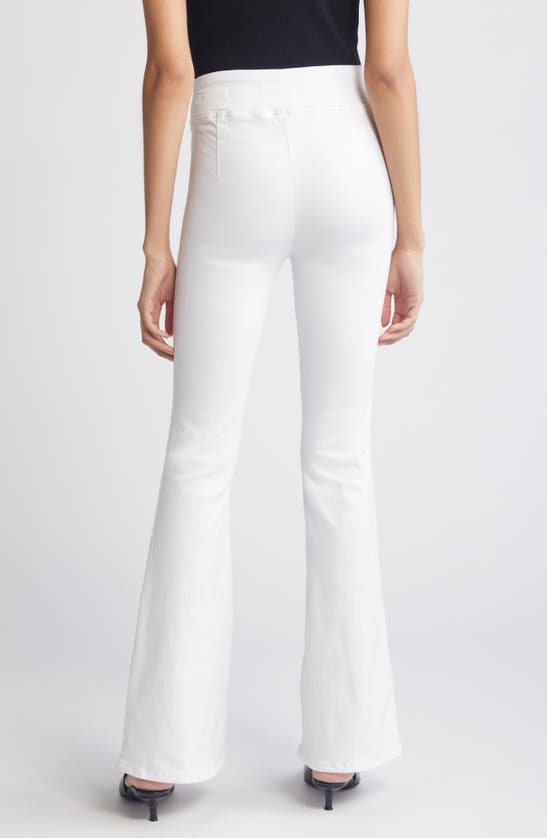 Shop Frame The Jet Set Flare Pull-on Jeans In White
