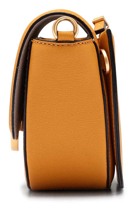 Shop Oryany Lottie Leather Saddle Crossbody Bag In Yellow