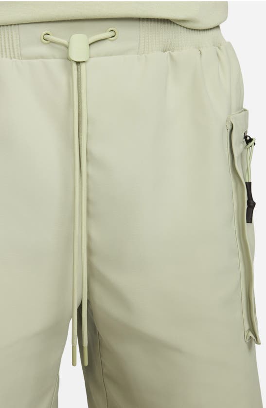 Shop Nike Sportswear Tech Pack Utility Shorts In Olive Aura/ Black/ Olive Aura
