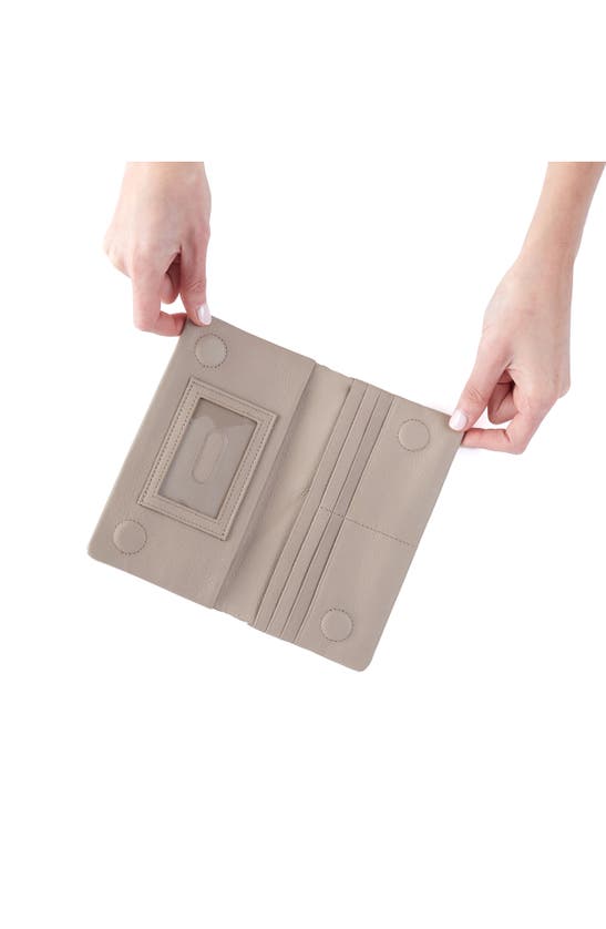 Shop Hobo Lumen Leather Bifold Wallet In Taupe