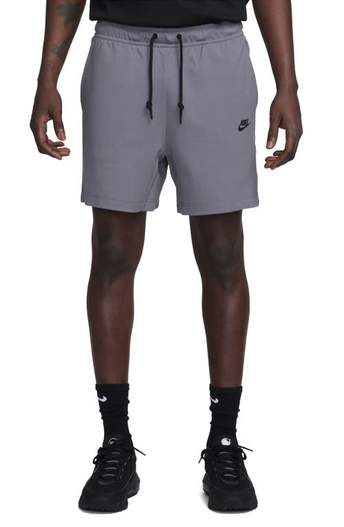 Shop Nike Lightweight Tech Knit Shorts In Light Carbon/black