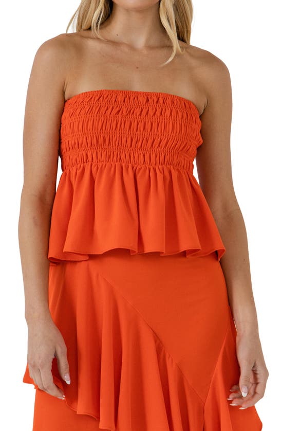 Endless Rose Smocked Strapless Peplum Top In Orange