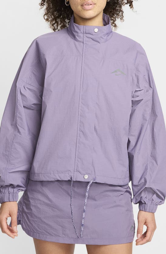 Shop Nike Trail Repel Water Repellent Running Jacket In Daybreak/ Court Purple