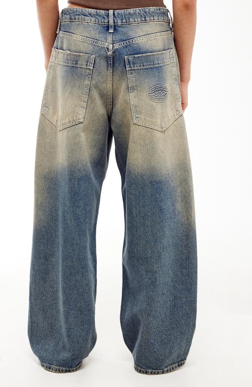 Shop Bdg Urban Outfitters Jaya Tinted Baggy Low Rise Wide Leg Jeans In Mid Vintage