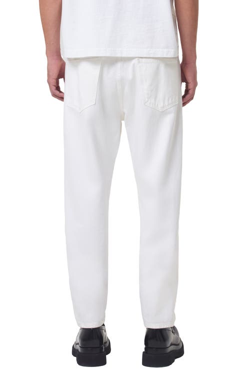 Shop Agolde Curtis Relaxed Tapered Organic Cotton Jeans In Fortune Cookie