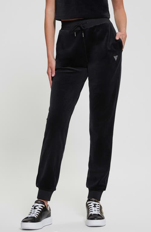 Shop Guess Couture Crystal Logo Embellished Velour Joggers In Jet Black