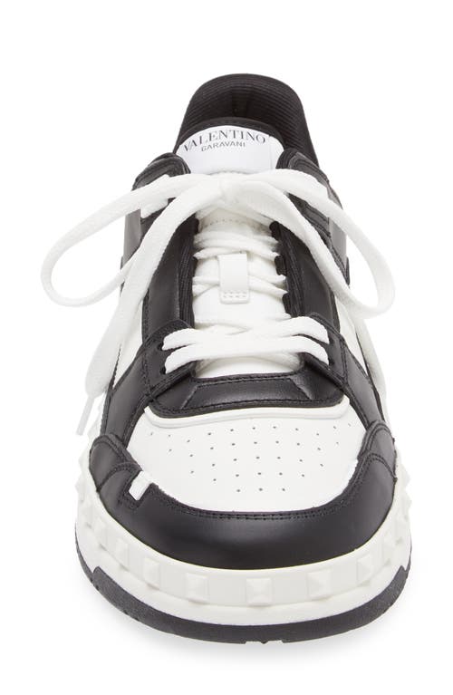 Shop Valentino Garavani Rockstud Low Top Sneaker In Bianco/nero